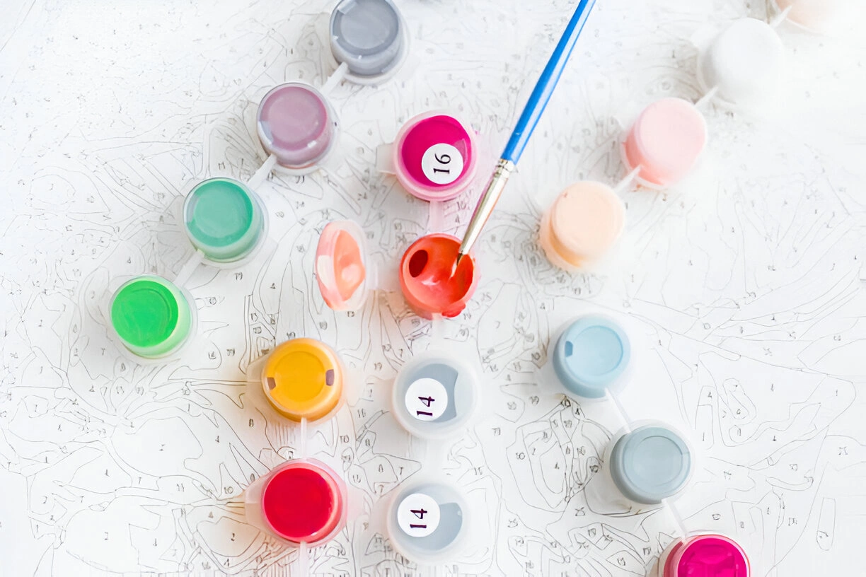 workspace setup with paints and brushes